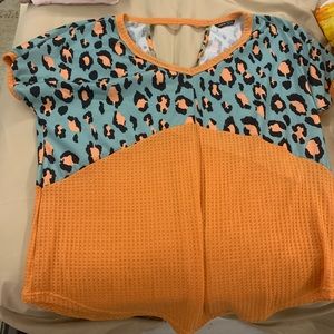 Peach/ pink Cheetah print with blue shirt.